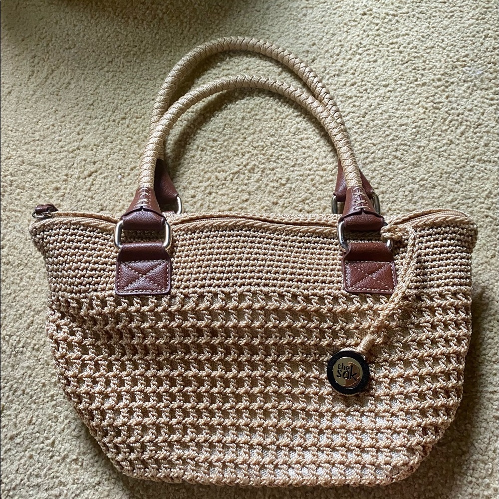 The Sak tan woven lined handbag w/leather accents